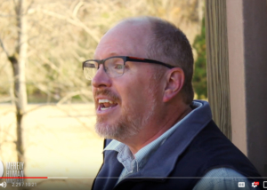 Screenshot of a video of Jay Watts speaking